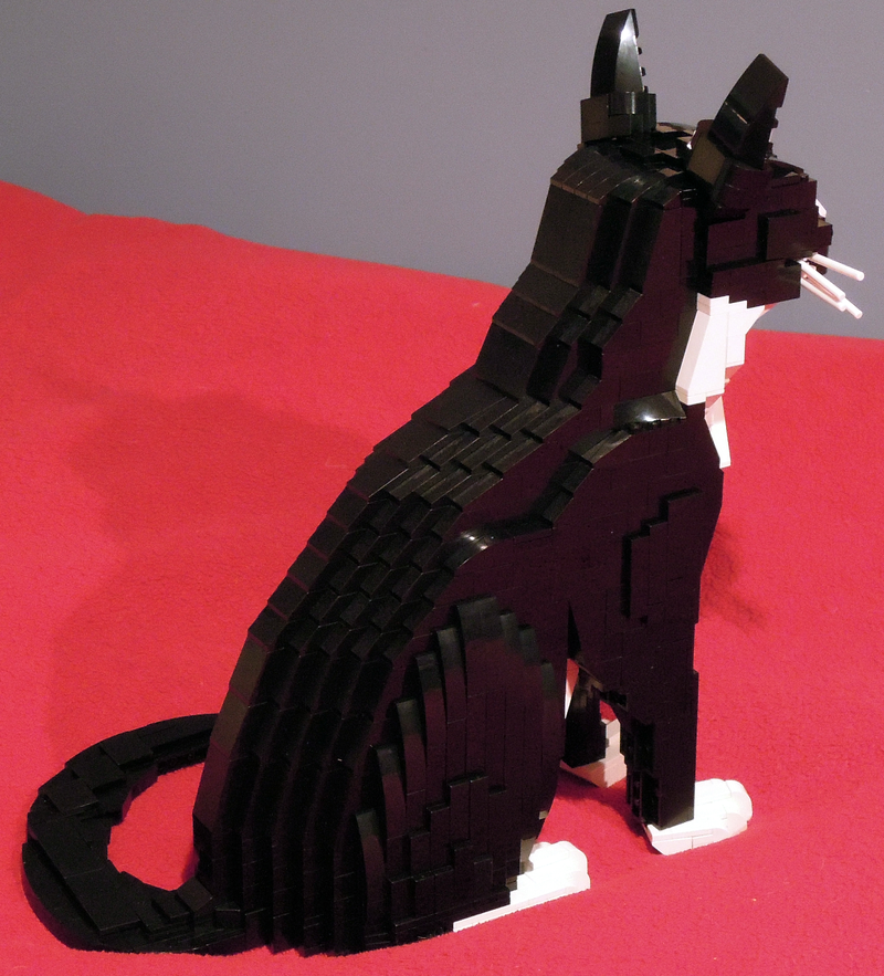 Illustration for article titled Cooper the Lego cat has haunting green eyes